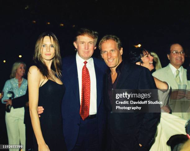 From left, American real estate developer Donald Trump and his girlfriend , former model Melania Knauss, musician Michael Bolton, and British...