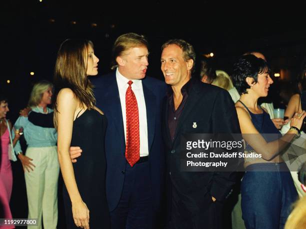 From left, American real estate developer Donald Trump and his girlfriend , former model Melania Knauss, financier Jeffrey Epstein, and British...