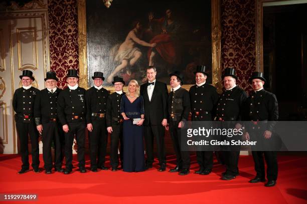 Bavarian Prime Minister Dr. Markus Soeder and his wife Karin Soeder with chimney sweepers during the new year reception of the Bavarian state...