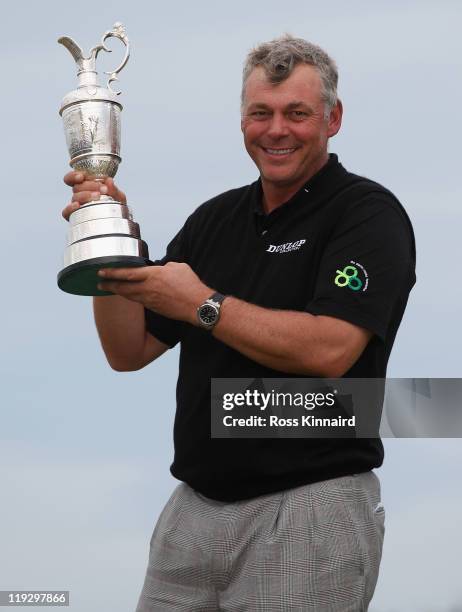 Darren Clarke of Northern Ireland holds the Claret Jug following his victory at the end of the final round of The 140th Open Championship at Royal St...