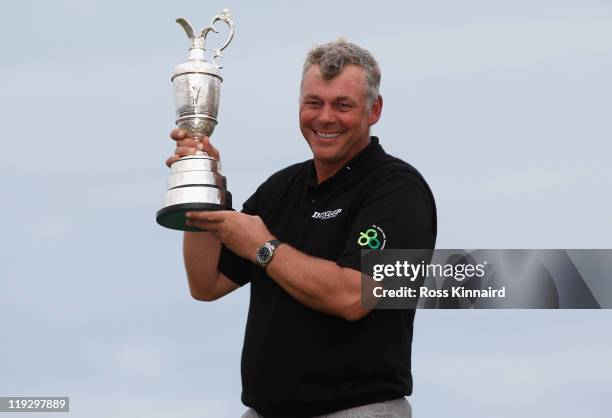 Darren Clarke of Northern Ireland holds the Claret Jug following his victory at the end of the final round of The 140th Open Championship at Royal St...