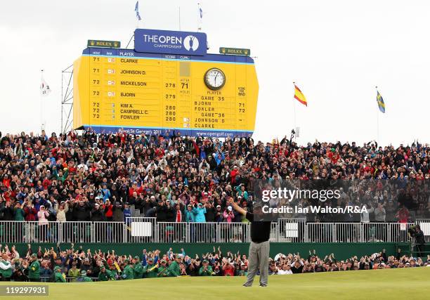 Darren Clarke of Northern Ireland celebrates victory on the 18th green during the final round of The 140th Open Championship at Royal St George's on...