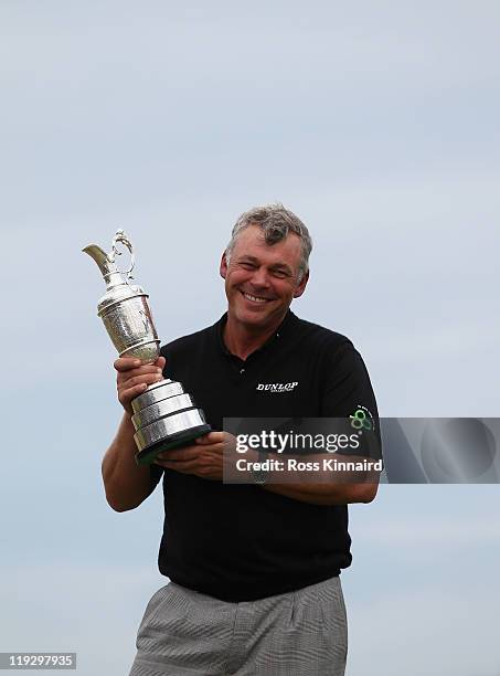 Darren Clarke of Northern Ireland holds the Claret Jug following his victory at the end of the final round of The 140th Open Championship at Royal St...