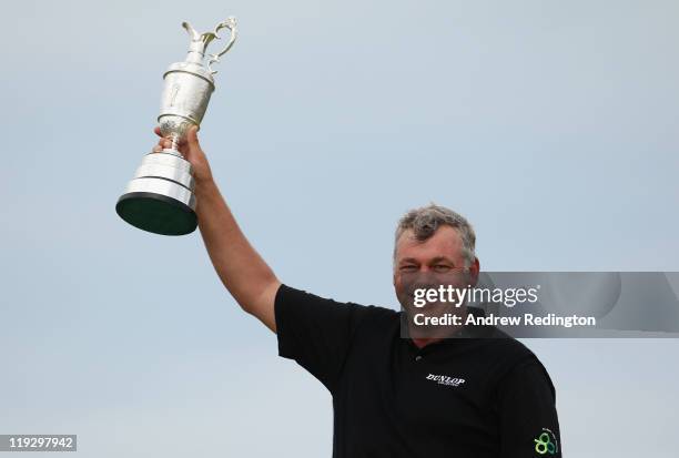 Darren Clarke of Northern Ireland holds the Claret Jug following his victory at the end of the final round of The 140th Open Championship at Royal St...