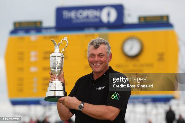 Darren Clarke of Northern Ireland holds the Claret Jug following his victory at the end of the final round of The 140th Open Championship at Royal St...