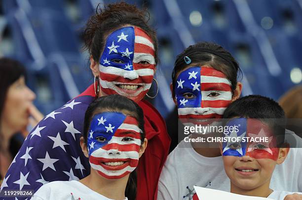 Supporters with their faces painted pose prior to the FIFA Women's Football World Cup final match Japan vs USA on July 17, 2011 in Frankfurt am Main,...