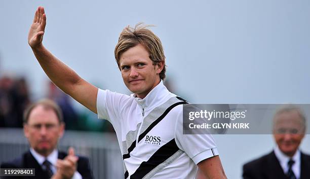 English golfer Tom Lewis waves as he received the Silver Medal after finishing highest ranking amateur 9 over par, on the final day of the 140th...