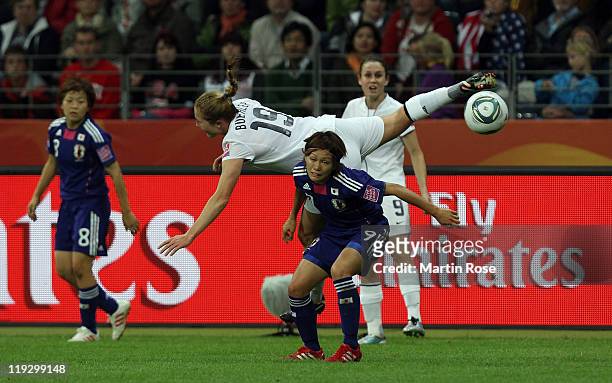 Nahomi Kawasumi of Japan and Rachel Buehler of USA battle for the ball during the FIFA Women's World Cup Final match between Japan and USA at the...