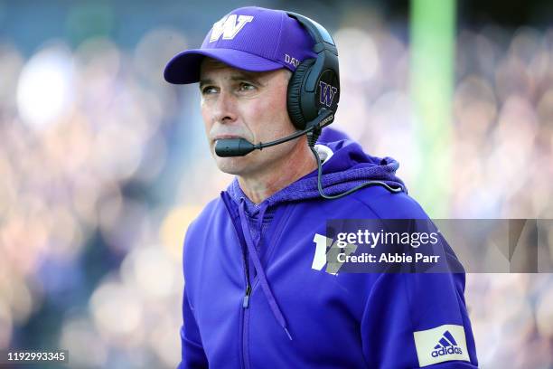 Head Coach Chris Petersen of the Washington Huskies looks on in the first quarter against the Washington State Cougars during their game at Husky...