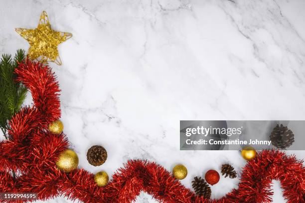 christmas decoration on white marble background - yule marble stock pictures, royalty-free photos & images