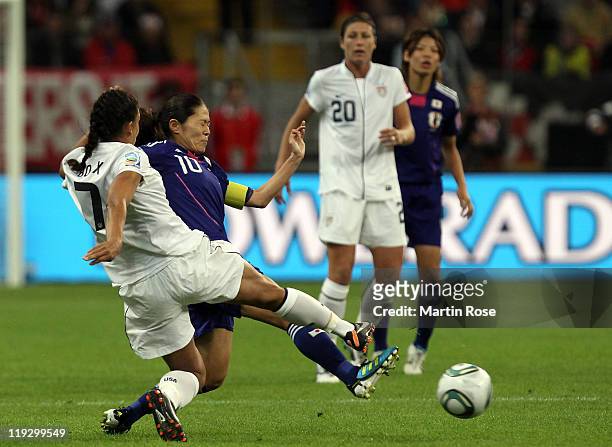 Homare Sawa of Japan and Shannon Boxx of USA battle for the ball during the FIFA Women's World Cup Final match between Japan and USA at the FIFA...