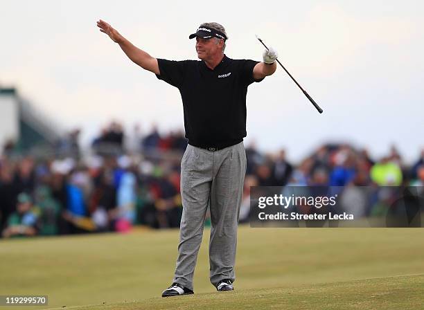 Darren Clarke of Northern Ireland quiets the crowd on the 18th hole during the final round of The 140th Open Championship at Royal St George's on...