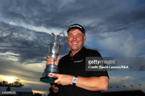 Darren Clarke of Northern Ireland poses with the Claret Jug following his victory at the end of the final round of The 140th Open Championship at...