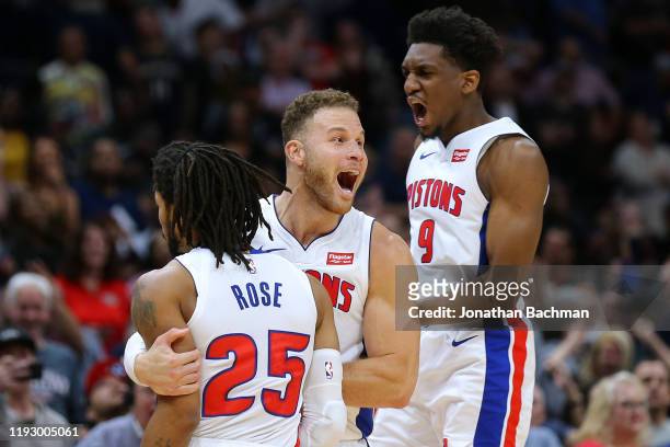 Derrick Rose of the Detroit Pistons celebrates a game-winning score with Blake Griffin and Langston Galloway against the New Orleans Pelicans at the...