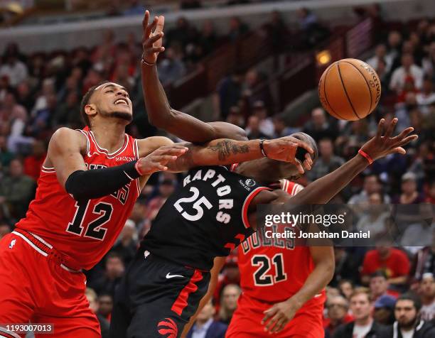 Chris Boucher of the Toronto Raptors and Daniel Gafford of the Chicago Bulls battle for the ball at the United Center on December 09, 2019 in...