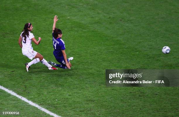 Alex Morgan of USA scores her first goal against Saki Kumagai of Japan during the FIFA Women's World Cup Final match between Japan and USA at the...