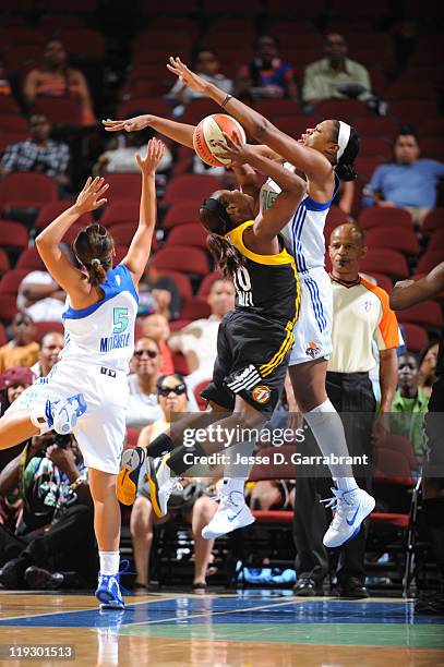 Kia Vaughn of the New York Liberty defends against Andrea Riley of the Tulsa Shock during a game on July 17, 2011 at the Prudential Center in Newark,...