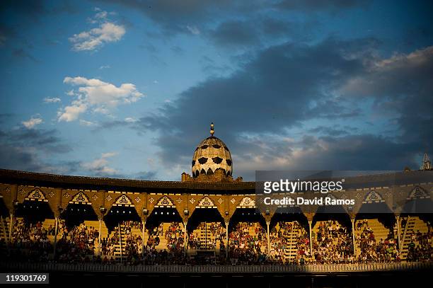 Spectators follow the performance of bullfighters during the third bullfight of the 2011 season at the Monumental bullring on July 17, 2011 in...