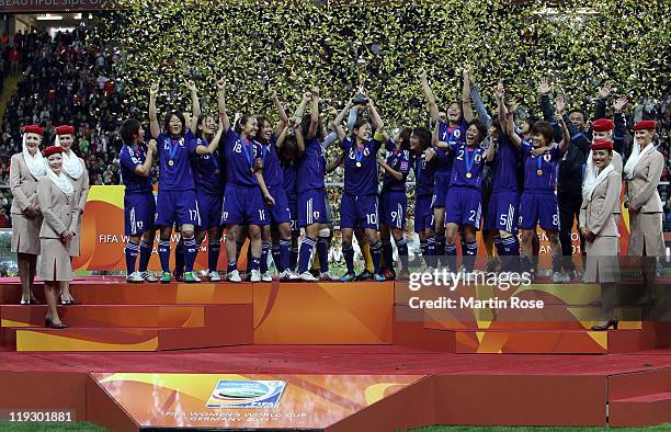 Homara Sawa of Japan lifts the trophy after winning the FIFA Women's World Cup Final match between Japan and USA at the FIFA World Cup stadium...