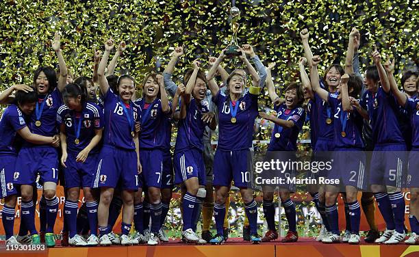 Homara Sawa of Japan lifts the trophy after winning the FIFA Women's World Cup Final match between Japan and USA at the FIFA World Cup stadium...