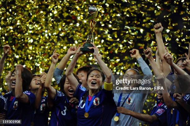 Homare Sawa of Japan lifts the trophy after winning the FIFA Women's World Cup Final match between Japan and USA at the FIFA Women's World Cup...