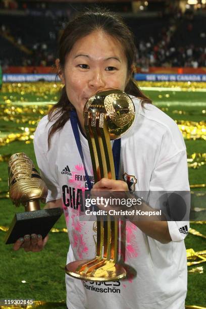 Homare Sawa of Japan kisses the trophy after weinning 5-3 after penalty shoot-out the FIFA Women's World Cup Final match between Japan and USA at the...