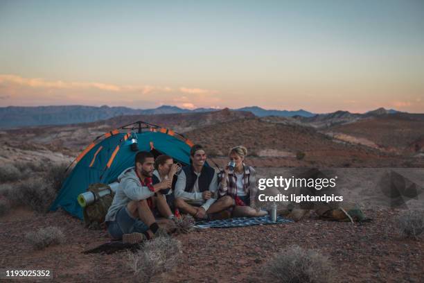 a hiker group at sunset - nevada hiking stock pictures, royalty-free photos & images