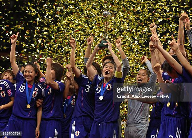 Homare Sawa the captain of Japan lifts the Women's World Cup after victory over USA in the FIFA Women's World Cup Final match between Japan and USA...