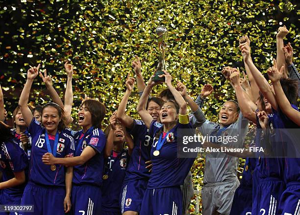 Homare Sawa the captain of Japan lifts the Women's World Cup after victory over USA in the FIFA Women's World Cup Final match between Japan and USA...