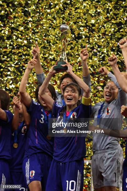 Homare Sawa the captain of Japan lifts the Women's World Cup after victory over USA in the FIFA Women's World Cup Final match between Japan and USA...
