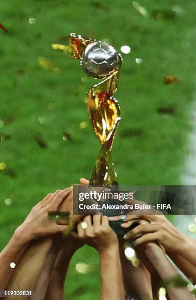 Players of Japan hold up the trophy as they celebrate their victory of the FIFA Women's World Cup Final match between Japan and USA at the FIFA World...