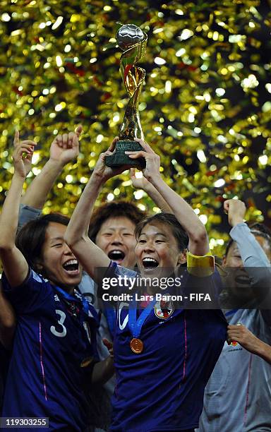 Homare Sawa of Japan lifts the trophy after winning the FIFA Women's World Cup Final match between Japan and USA at the FIFA Women's World Cup...
