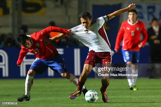 Gary Medel from Chile fights for the ball against Juan Arango from Venezuela during a quarter final match between Chile and Venezuela at...