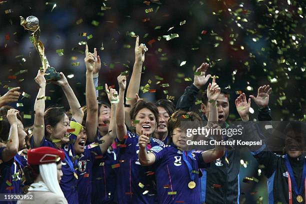 Homare Sawa of Japan lifts the winning trophy on the podium after winning 5-3 after penalyts shoot-out the FIFA Women's World Cup Final match between...