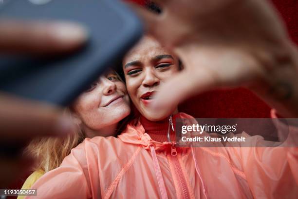 close-up of young friends photographing outdoors - lifestyle selective focus stock pictures, royalty-free photos & images