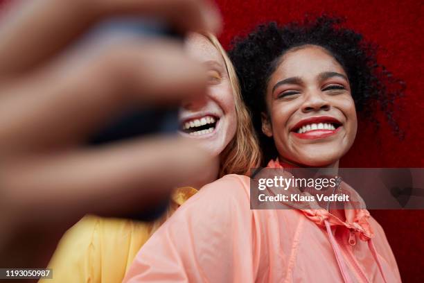 close-up of young females photographing outdoors - obscured face phone stock pictures, royalty-free photos & images