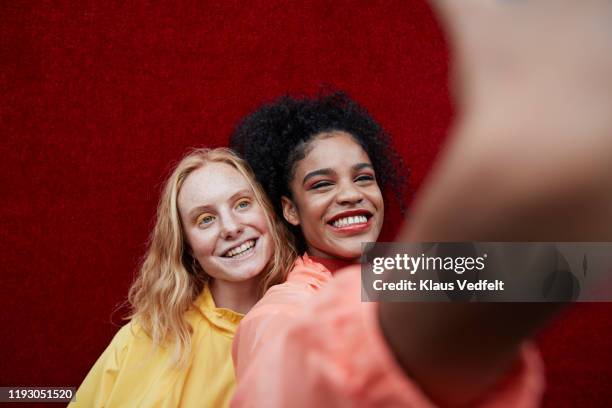 close-up of beautiful women photographing outdoors - friends women makeup ストックフォトと画像