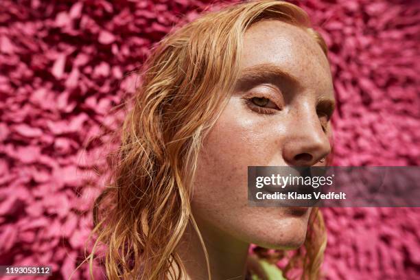 close-up beautiful woman against textured wall - wet hair stock pictures, royalty-free photos & images