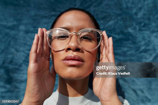 beautiful woman wearing eyeglasses - womans hand on hip stock pictures, royalty-free photos & images