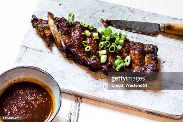 sticky spareribs with scallions and homemade barbecue sauce - rib food stock pictures, royalty-free photos & images