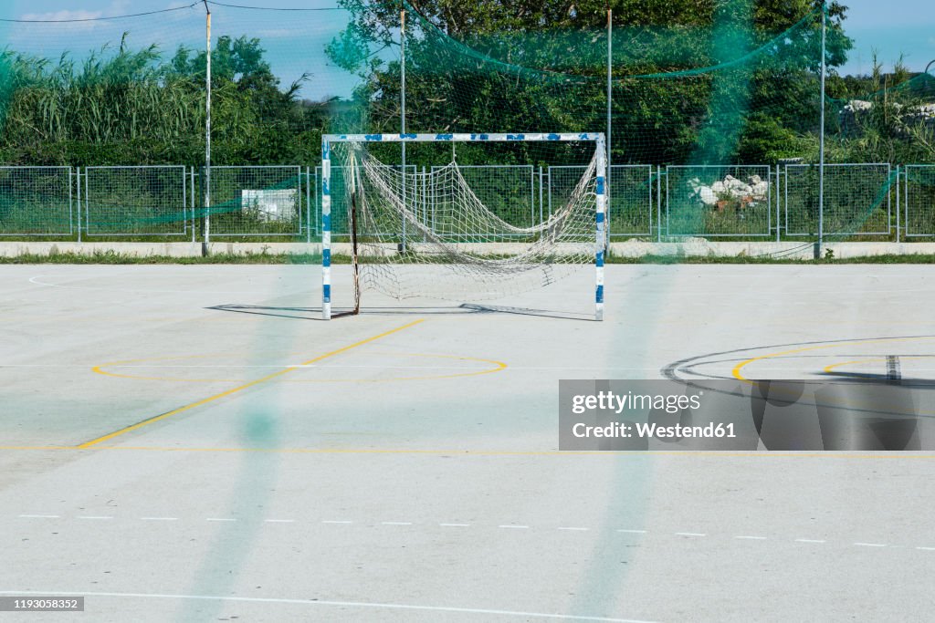 Croatia, Nin, Soccer goal standing in empty schoolyard