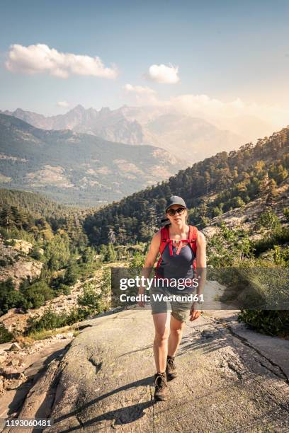 female hiker during hike, haute-corse, corsica, france - haute corse stock pictures, royalty-free photos & images