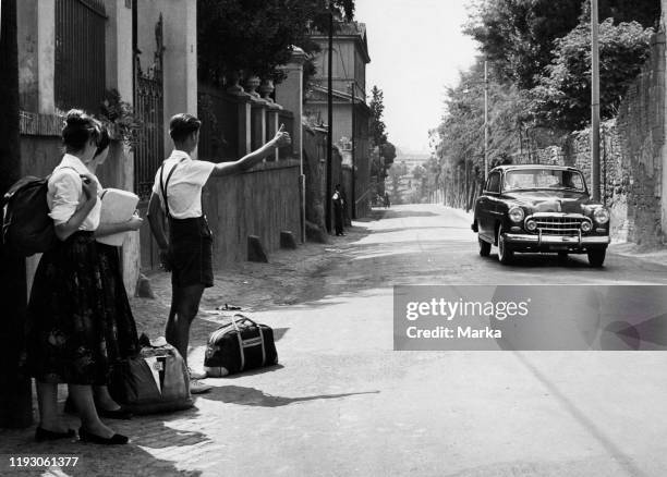 Rome. Young German tourists hitchhike on the Via Cassia. 1960.