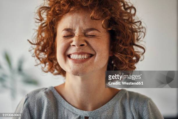 portrait of a happy woman with closed eyes - freude stock-fotos und bilder