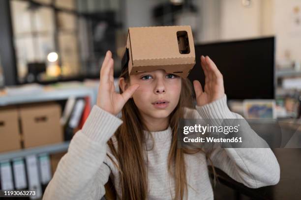 girl with cardboard vr glasses in office - cardboard vr stock pictures, royalty-free photos & images