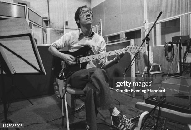 English multi-instrumentalist, vocalist and songwriter Hank Marvin of rock band The Shadows during a recording session at Abbey Road Studios, London,...