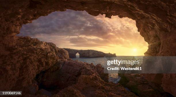 cliffs at sunset, menorca, spain - minorca stock-fotos und bilder