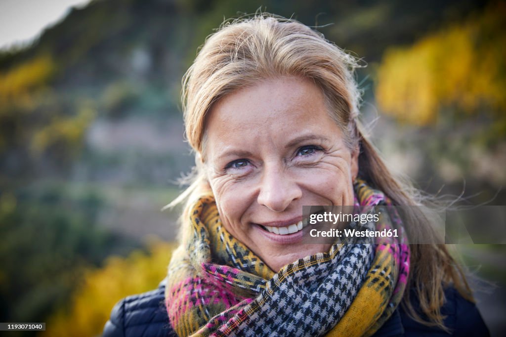 Portrait of a smiling mature woman outdoors