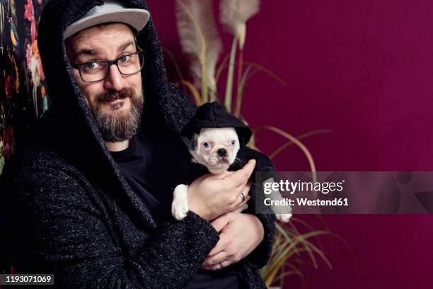 man holding his pug - irony stock pictures, royalty-free photos & images