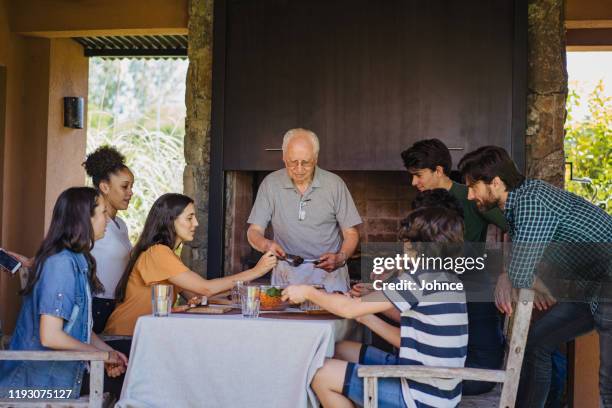 traditional reunion of argentinian family - gaucho stock pictures, royalty-free photos & images